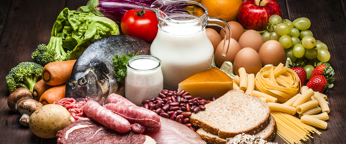 Variety of meats, fruits and vegetables on a table